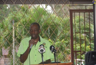 Minister without Portfolio in the Ministry of Industry, Commerce, Agriculture and Fisheries, Hon. J.C. Hutchinson, speaks at the opening of the rehabilitated Dragoon to Flagstaff and Prosper to Tangle River roadways in South St. James, on Wednesday, January 22.