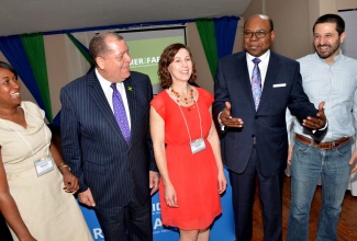 Minister of Tourism, Hon. Edmund Bartlett (second right), shares a light moment with (from left): Jamaica Representative, Marsha Johnson; Minister of Industry, Commerce, Agriculture and Fisheries,  Hon. Audley Shaw;  United States Representatives, Megan Wall and Michael Moscarelli. Occasion was the USAID Farmer to Farmer Conference 2020,   held at The Liguanea Club in New Kingston, on Monday (January 6).