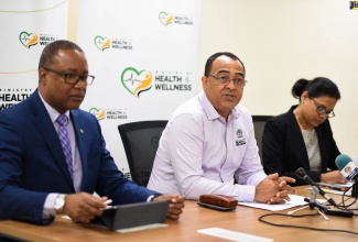 Minister of Health and Wellness, Dr. the Hon. Christopher Tufton (centre), addresses journalists at a media briefing, held at the Ministry’s New Kingston offices on February 5, where he provided an update on Jamaica’s national emergency response and preparedness for the novel coronavirus. With the Minister (from left) are Permanent Secretary in the Ministry, Dunstan Bryan; and Chief Medical Officer, Dr. Jacquiline Bisasor McKenzie.