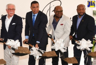 Prime Minister, the Most Hon. Andrew Holness (second  left), breaks  ground for a US$1 billion multi-resort development - Sugarcane Bay Jamaica - in Llandovery, St. Ann, on Friday, February 28. Also taking part (from left) are:  Chief Sales and Marketing Officer at Karisma Hotels & Resorts, Armando Chomat;  Minister of Tourism, Hon. Edmund Bartlett; and Mayor of St. Ann's Bay, Councillor Michael Belnavis.