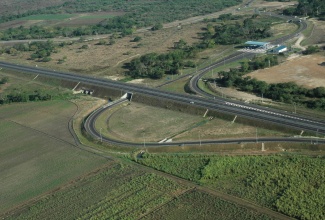 An aerial view of the East West Toll Road and the Spanish Town Toll Plaza, which are part of the road infrastructure network that is being operated by TransJamaican Highway (TJH) under a 35-year concession arrangement with the National Road Operating and Constructing Company (NROC) on behalf of the Government of Jamaica. Ten billion shares are being floated in the  TJH Initial Public Offering (IPO), which closes on Monday, March 2. 