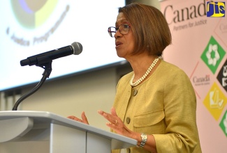 Permanent Secretary in the Ministry of Justice, Sancia Templer Bennett, speaks at the opening ceremony of the 11th annual Restorative Justice Conference, at the AC Marriott Hotel in Kingston, recently.