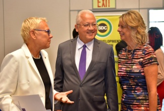 Justice Minister, Hon. Delroy Chuck (centre), converses with Head of the European Union (EU) Delegation to Jamaica, Ambassador Malgorzata Wasilewska (left), and Canada’s High Commissioner to Jamaica, Her Excellency Laurie Peters. The occasion was the opening ceremony of the 11th annual Restorative Justice Conference at the AC Marriott Hotel in Kingston on Friday (February 7). 