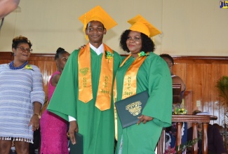 Aneshia Brown (right), and her son, Orlando Barrett, at the 50th Grange Hill High School graduation ceremony held on February 20 at the Grange Hill New Testament Church of God in Westmoreland. The mother and son participated in the National Unattached Youth Programme (NUYP) offered at the school.