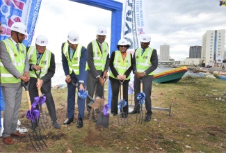 Prime Minister, the Most Hon. Andrew Holness (third left), breaks ground for the commencement of the Port Royal Coastal Revetment Project, downtown Kingston, on Tuesday (March 3).  Also participating in the ground breaking (from left) are Mayor of Kingston, Senator Councillor Delroy Williams; Minister without Portfolio in the Office of the Prime Minister, Mike Henry; Chairman, Jamaica Social Investment Fund (JSIF), Dr. Wayne Henry; and Caribbean Director, World Bank, Tahseen Sayed; and Managing Director, JSIF, Omar Sweeney. 
 
