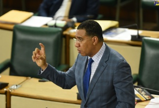 Prime Minister, the Most Hon. Andrew Holness, highlights a point while making a statement in the House of Representatives on Tuesday (July 28). 

