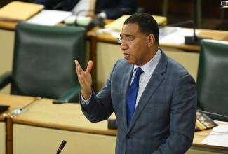 Prime Minister, the Most Hon. Andrew Holness, emphasises a point as he delivers a statement in the House of Representatives on Tuesday (July 28). 
