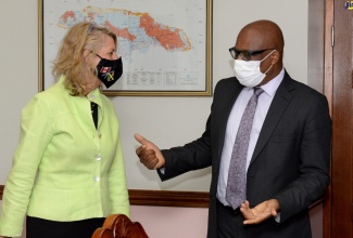 Minister without Portfolio in the Ministry of Economic Growth and Job Creation, Hon. Leslie Campbell, greets Canada’s High Commissioner to Jamaica, Her Excellency Laurie Peters, during her courtesy call at the Ministry’s offices on Dominica Drive in New Kingston, on Thursday (July 9). Mr. Campbell and Mrs. Peters had discussions on a wide range of matters of mutual interest, including projects and programmes being undertaken to bolster Jamaica’s climate resilience and environmental sustainability with funding and technical support from Canada.      

