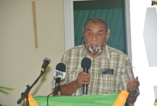 Chairman of the St. Elizabeth Municipal Corporation, Councillor Derrick Sangster, addresses a shelter management forum held at the St. Matthew's Anglican Church in Santa Cruz, St. Elizabeth, on Friday (July 10).