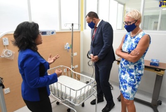 Minister of Health and Wellness, Dr. the Hon. Christopher Tufton (centre), and Head of the European Union (EU) Delegation to Jamaica, Ambassador Malgorzata Wasilewska (right), tour a room in the High Dependency Unit (HDU) at the Bustamante Hospital for Children, at the official opening of the facility on Tuesday (July 14).  At left, Senior Medical Officer (SMO) at the hospital, Dr. Michelle-Ann Richards Dawson, provides details about the specialised equipment in the unit.

 