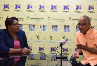 Programme Manager of the Citizen Security and Justice Programme (CSJP) III, Orville Simmonds (right), speaks at a recent JIS ‘Think Tank’. With  Mr. Simmonds is Acting Chief Technical Director,  Ministry of National Security, Shauna Trowers.

