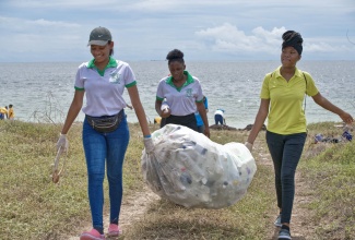 Volunteers from the Shortwood Teachers’ College remove garbage from a stretch on the Half Moon Bay Beach in St. Catherine during the 2019 International Coastal Clean-up Day (ICCD) activities with the National Environment and Planning Agency (NEPA).