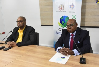 Minister of Tourism,  Hon. Edmund Bartlett (right),  and Executive Director of the Global Tourism Resilience and Crisis Management Centre (GTRCMC), Professor Lloyd Waller,  at  a virtual press conference at the Centre, located at  the University of the West Indies, Mona, Kingston, on October 26.

