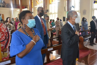 Minister of Culture, Gender Entertainment and Sport, Hon. Olivia Grange (left), and Minister of National Security, Hon. Dr. Horace Chang, join the congregation of the William Knibb Memorial Baptist Church in Falmouth, Trelawny, in reciting the National Pledge during the National Heritage Week Thanksgiving Church Service on Sunday (October 18).

