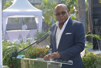 Minister of Tourism, Hon. Edmund Bartlett, addresses the ground breaking ceremony for the rebranded Shoppes at Rose Hall in Montego Bay, St. James Thursday (October 29). 
