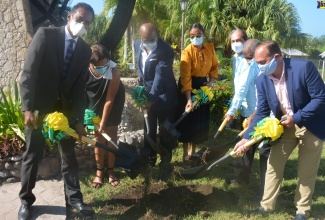 Minister of Tourism, Hon Edmund Bartlett (3rd  left) breaks ground for the rebranding of The Shoppes at Rose Hall in Montego Bay , St. James on Thursday (October 29). Others participating (from left) include: Executive Director of the Tourism Enhancement Fund (TEF), Dr. Carey Wallace; Executive Director of Jamaica Vacations (JamVac), Joy Roberts; Regional Director of Tourism, Jamaica Tourist Board (JTB), Odette Dyer; Chief Executive Officer of Chandiram Limited, Anup Chandiram; Chairman of the TEF, Godfrey Dyer and Chairman of the Tourism Product Development Company, Ian Dear.