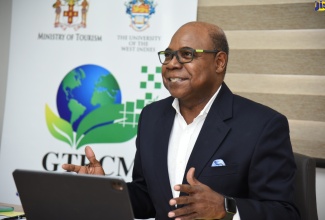 Minister of Tourism, Hon Edmund Bartlett, addresses a virtual board meeting of the Global Tourism Resilience and Crisis Management Centre (GTRCMC) at the entity’s location at the University of the West Indies (UWI), Mona, St. Andrew on Saturday (November 21).

 