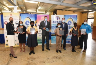 Prime Minister, the Most Hon. Andrew Holness (fourth left), partcipates in a ceremony for the handing over of tablets to students of the Drews Avenue Primary and Infant School in St. Andrew on November 4.  Displaying devices (from left) are Minister of Education, Youth and Information, Hon. Fayval Williams; Chairman, Drews Avenue Primary and Infant School, Naomi Francis; students at the institution, Shanaouyah Laird and Odaine Dixon; Minister of Science, Energy and Technology, Hon. Daryl Vaz; student, Anecia Stewart; and Chairman, e-Learning Jamaica Company Limited, Christopher Reckord.

 
