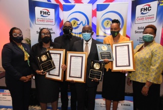 The Civil Servants of the Year for 2020: Juliet Lakeman (second left);  Stephen Williams (fourth left) and Marie Hall (fifth left), display their awards at a ceremony held on December 4 at the Jamaica Pegasus Hotel, in New Kingston.  With them (from left) are: Vice-Chairman of the Board of Directors, First Heritage Co-operative Credit Union Limited (FHC), Leodis Douglas; Chairman of the Board of Directors, FHC and President of the Jamaica Civil Service Association, O’Neil Grant and Chief Executive Officer at FHC, Roxann Linton.