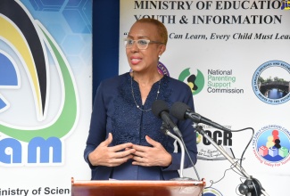 Minister of Education, Youth and  Information, Hon. Fayval Williams, addresses a tablet computer presentation ceremony at Seaforth Primary School in St. Thomas, on December 11.

