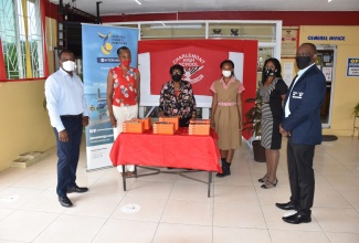 From left to right – JEP Group President & CEO, Wayne McKenzie, OD; Acting Principal of Charlemont High School, Jennifer Gidden; Vice Principal, Maurice Sullivan; student, Abigail Smith; Senior Teacher, Sharon Mclean and JEP Group CTO, Cecil Gordon.