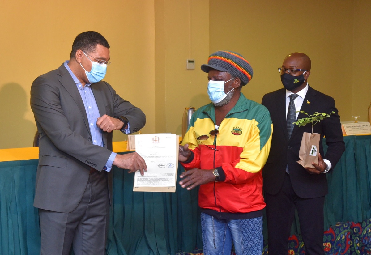 Prime Minister Presents Land Titles To 33 Persons