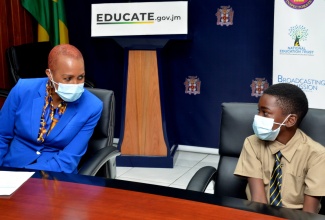 Minister of Education, Youth and Information,  Hon. Fayval Williams (left), speaks with Avatar Muschette at the offices of the Ministry of Education, Youth and Information, on Thursday (February 4). 