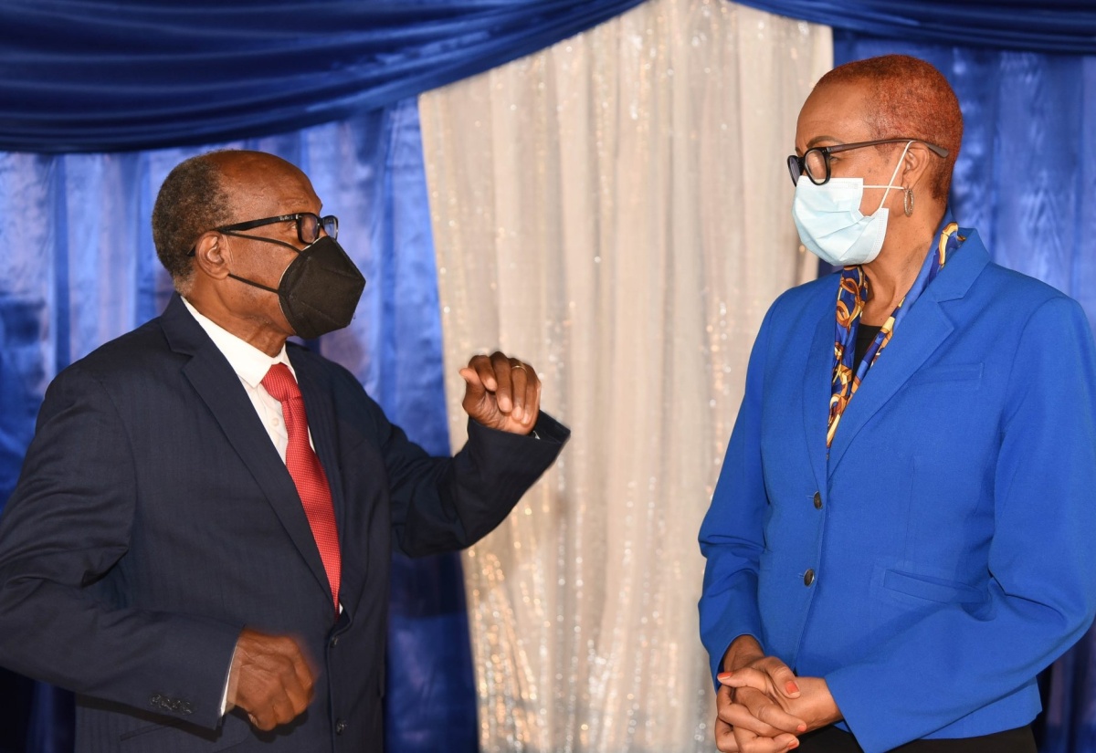 Minister of Education, Youth and Information, Hon. Fayval Williams (right), is in conversation with Chairman of the Cedar Grove Academy in Portmore, St. Catherine, Rev. Dr. Wellesley Blair (left), during a special function held in his honour at the school on Thursday (February 4).