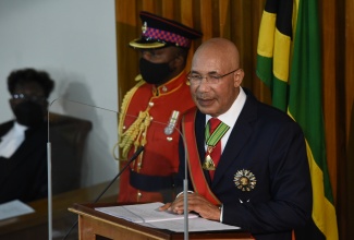 Governor-General, His Excellency the Most Hon. Sir Patrick Allen (right), delivers the 2021/22 Throne Speech under the theme ‘Building Forward…Stronger Together’, at the Ceremonial Opening of Parliament, on February 18.