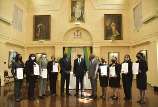 Governor-General, His Excellency the Most Hon. Sir Patrick Allen (centre), along with Chief Justice Bryan Sykes (fifth left) and President of the Court of the Appeal, Justice Patrick Brooks (fifth right), share a moment with members of the judiciary, who were sworn into higher office, during a ceremony held at King’s House in St. Andrew on April 7. They are (from left) Carla Thomas, Cresencia Brown Beckford, Evon Brown, Marsha Dunbar Green, Tania Mott Tulloch-Reid, Sandria Wong Small, Ann-Marie Lawrence Grainger and Heather Carnegie.

