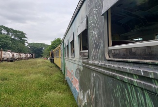 A passenger train on a test run from Spanish Town to Linstead on Thursday (May 20),  in preparation for the school train programme, awaits the passage of a bauxite train in Bog Walk to continue on its journey. The service is slated to begin in September with trips from Spanish Town to Linstead and Old Harbour.

