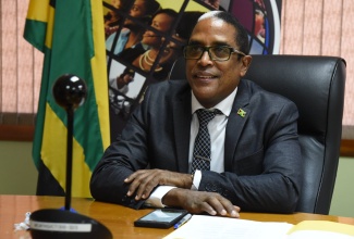 Minister of State in the Ministry of Industry, Investment and Commerce, Dr. Hon. Norman Dunn, addressing a webinar hosted by the Jamaica Association for Micro-Financing (JamFin) ​on May 13.