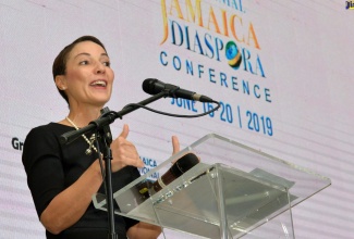 Minister of Foreign Affairs and Foreign Trade, Senator Hon. Kamina Johnson Smith, addresses a  plenary session during the 8th Biennial Jamaica Diaspora Conference at the Jamaica Conference Centre in downtown Kingston. (JIS File Photo)