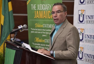 Minister of Science, Energy and Technology, Hon. Daryl Vaz, speaks at the contract signing and handover ceremony between the Universal Service Fund and the Court Administration Division, on June 3, at the Supreme Court.

 