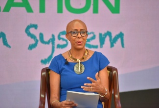 Minister of Education, Youth and Information, Hon. Fayval Williams clarifies a matter, while addressing a virtual Town Hall on Vaccine Sensitisation for the Education System on Friday (June 11). 

