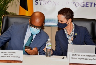 Minister of State in the Ministry of Foreign Affairs and Foreign Trade, Senator the Hon. Leslie Campbell (left), consults with Portfolio Minister, Senator the Hon. Kamina Johnson Smith, just before the start of the two-day virtual Jamaica Diaspora Sustainability Symposium on Wednesday (June 16).

 