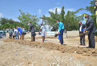 Prime Minister, the Most Hon. Andrew Holness (third left),  breaks ground for the construction of a new performing arts centre at St. Catherine High School, on Friday (June 18). Also participating (from left) are: Member of Parliament, St. Catherine South Central, Dr. Andrew Wheatley; Minister of Education, Youth and Information, Hon. Fayval Williams; Chairman, St. Catherine High School Board, Ms. Sharon Dale; Chief Executive Officer, CHASE Fund, Billy Heaven, and Principal, St. Catherine High School, Mr. Marlon Campbell.