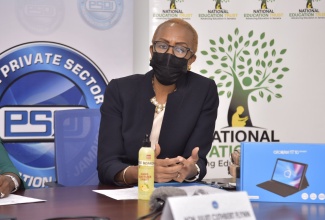 Minister of Education, Youth and Information, Hon. Fayval Williams, addresses the official handing over of computer devices by President of the Private Sector Organisation of Jamaica (PSOJ), Keith Duncan, his wife, Wendy and son, Zachary, to the ‘One Laptop or Tablet Per Child Initiative’, during a ceremony at the PSOJ’s Hope Road offices in St. Andrew on July 6. The devices, which include 17 tablets and seven laptops, will benefit students of Mannings Hill Primary School, Stony Hill Primary and Infant School, Golden Spring Primary School and Lawrence Tavern Primary School.

