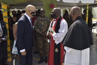 Their Excellencies, the Governor-General, the Most Hon. Sir Patrick Allen (left), and Lady Allen (2nd left, partly hidden), greet officiating priest for Sunday’s (July 25) Jamaica National Drumhead Church Service, Major Rev. Dr. Damian Ffriend (2nd right), and assistant officiating priest, Major Rev. Milverton Munroe (right). The service was held at the Jamaica Defence Force’s (JDF) Curphey Barracks, Up Park Camp, Kingston.