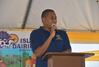 Minister of Agriculture and Fisheries, Hon. Floyd Green, addresses the silage handing over ceremony which was held at the Island Dairies Limited dairy farm in Goshen, St. Elizabeth on Friday (July 23 )