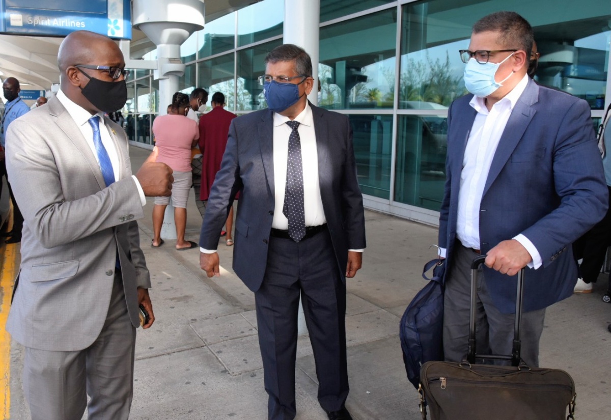 PHOTOS: Minister Pearnel Charles Jr. Greets The Rt. Hon. Alok Sharma At NM Airport