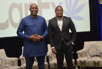 Minister of Agriculture and Fisheries, Hon. Floyd Green (right), with St. Vincent and the Grenadines’ Minister of Agriculture, Forestry, Fisheries, Rural Transformation, Industry and Labour, Saboto Caesar (left), on day one of the inaugural CanEx Psychedelics Summit, at the Jewel Grande Montego Bay Resort and Spa in Montego Bay, St. James, on July 15.