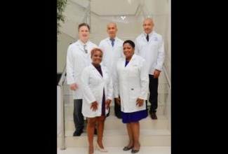 Members of the i-doc Concierge Wellness Services team (front, from left), Managing Director, Dr Sherridene Lee; and Director, Dr. Jacqueline Chambers, and (back, from left), Director, Dr. Witold Radomski; and Partner Doctors, Dr. Alvin Wong; and  Dr. Garfield Chapman.

