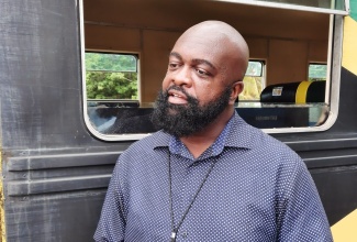 Deputy Managing Director, Operations at the Jamaica Urban Transit Company (JUTC), Owen Smith explains the JUTC's role in the School Train Service that is to be rolled out by the Jamaica Railway Corporation in September.     Photo: Peta-Gay Hodges 