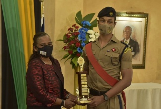 Major (Ret’d) and Royal Air Forces Association Jamaica (580) branch Chairman, Johanna Lewin (left), presenting the 2019 Wings Appeal Initiative third-place award to Cadet Jaheim Shields, who represented St. Catherine High School at the award ceremony held at the King’s House Ballroom in Kingston on Friday. (August 13)