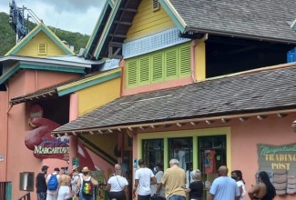 Guests from the Carnival Sunrise seen trekking into the popular Margaritaville attraction at the Island Village complex in Ocho Rios, St. Ann, on August 25.