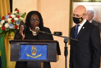 Governor-General, His Excellency the Most. Hon. Sir Patrick Allen (right), observes as Hon. Mrs. Justice Cresencia Brown Beckford takes the Oath of Office to act as Judge of the Court of Appeal, at a ceremony held at King’s House in Kingston, today (September 15).

 
