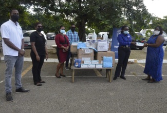 Chief Executive Officer of the Cornwall Regional Hospital (CRH) in St. James, Charmaine Williams-Beckford  (second right), accepts a donation of personal protective equipment (PPE)  from Director of the Kiwanis Club of Vista Montego Bay , Petrona Patten-Virgo (right), at CRH on Wednesday (September 29). Sharing the moment are (from left) President elect designate of the Kiwanis Club of Vista Montego Bay, Sheldon Dryden; Distinguished President of the organisation, Joanne Walker; Hospital Administrator at CRH, Shawnette Brown Smith, and Kiwanian, Olando Virgo.

 