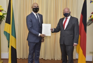 Governor-General, His Excellency, the Most Hon. Sir Patrick Allen (left,) accepts Letters of Credence from  Ambassador-designate of the Federal Republic of Germany to Jamaica, His Excellency Dr. Stefan Freidrich Keil, during a ceremony at King's House in St. Andrew on September 10. 