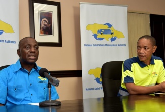 Executive Director of the National Solid Waste Management Authority (NSWMA), Audley Gordon (left), addressing a media briefing on September 10 at the NSWMA’s offices in Kingston. Also pictured is Board Chairman of the NSWMA, Dennis Chung.   

